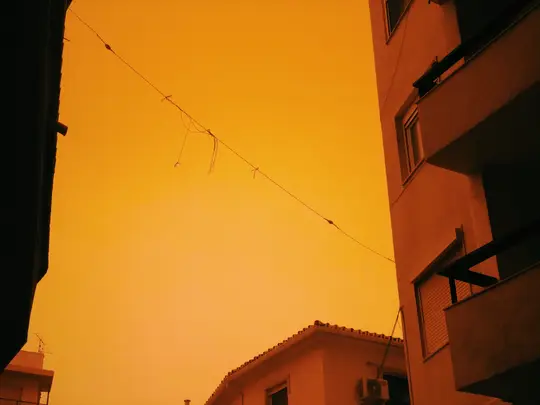 Peculiar reddish hue upon the city.